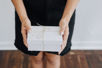 Woman holding a wrapped gift