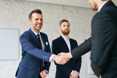 Businessmen shaking hands after successful negotiation