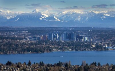 A view of seattle and its mountains and sea