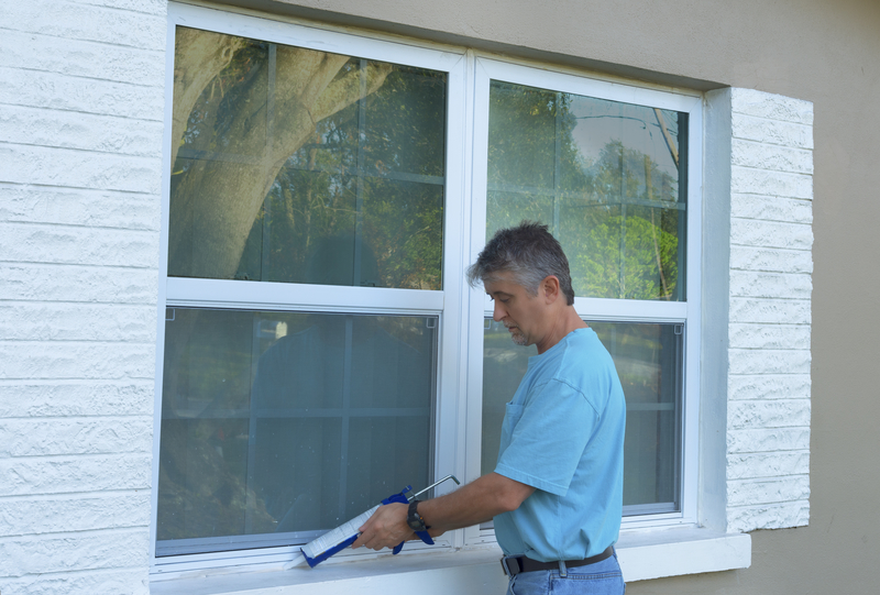 Man having a maintenance repair for windows
