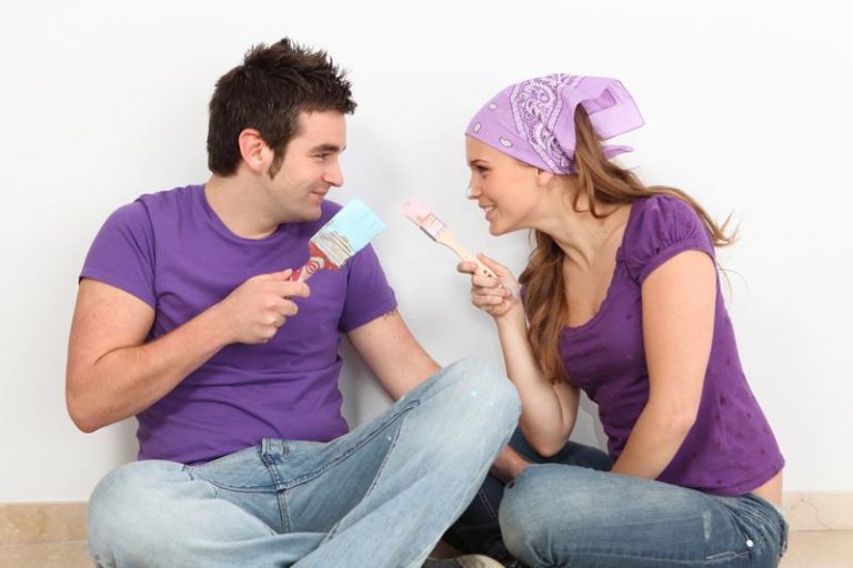 Man and a woman in a purple shirt talking